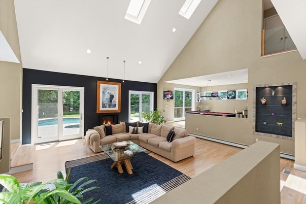 Fireplace, Game Room, Interior, Living room, Pendant Lights, Recessed Lighting, Wood Texture Flooring