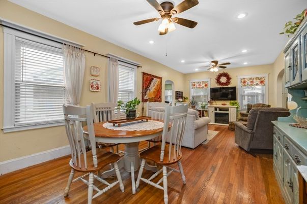 Dining room, Fireplace, Interior, Living room, Recessed Lighting, Wood Texture Flooring