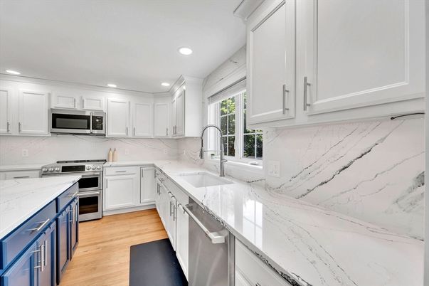 Interior, Kitchen, Marble Walls, Recessed Lighting, Stainless Steel Appliances, Wood Texture Flooring