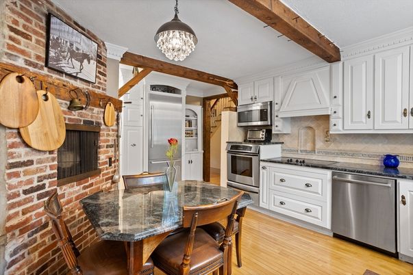 Chandelier, Dining room, Interior, Kitchen, Stainless Steel Appliances, Stone Walls, Wooden Beams, Wood Texture Flooring