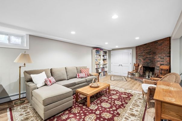 Fireplace, Interior, Living room, Recessed Lighting, Stone Walls, Wood Texture Flooring