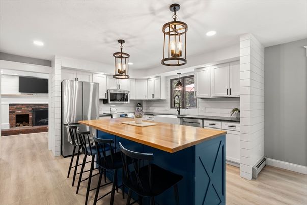 Fireplace, Interior, Kitchen, Pendant Lights, Recessed Lighting, Stainless Steel Appliances, Wood Texture Flooring