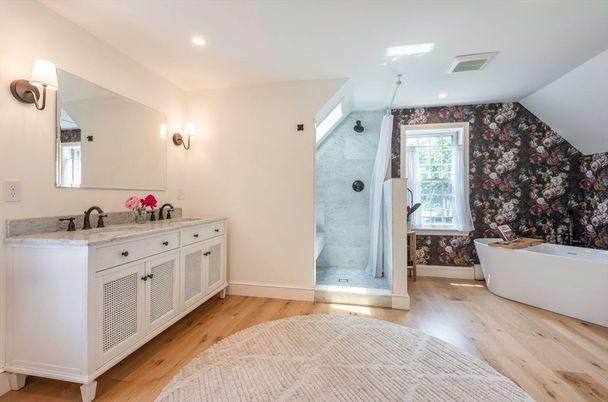 Bathroom, Dual Sink Vanities, Free Standing Baths, Glass Shower, Interior, Marble Walls, Recessed Lighting, Wood Texture Flooring