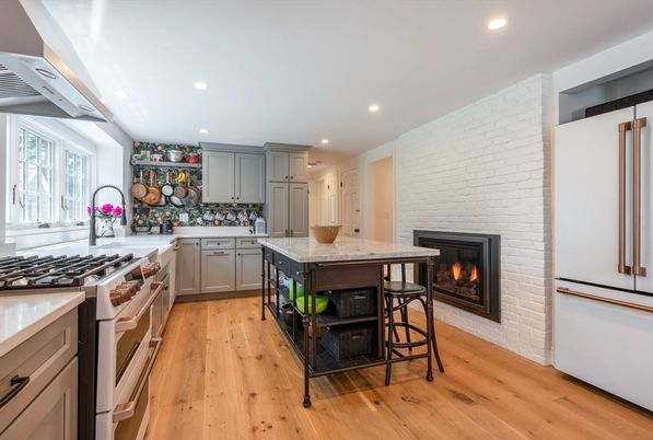 Fireplace, Interior, Kitchen, Recessed Lighting, Stainless Steel Appliances, Stone Walls, Wood Texture Flooring