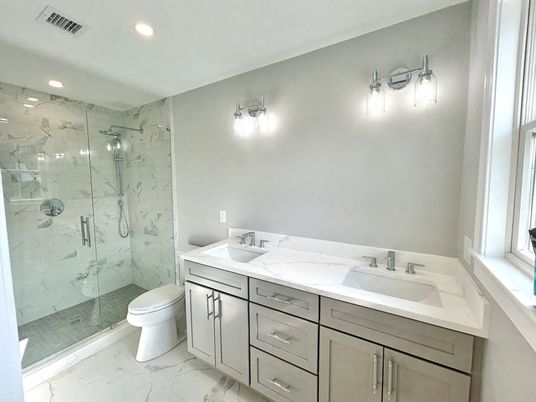 Bathroom, Dual Sink Vanities, Glass Shower, Interior, Marble, Marble Walls, Recessed Lighting