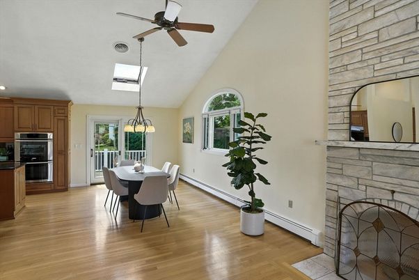 Dining room, Fireplace, Interior, Kitchen, Pendant Lights, Recessed Lighting, Stainless Steel Appliances, Stone Walls, Wood Texture Flooring