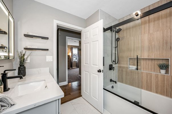 Bathroom, Dual Sink Vanities, Glass Shower, Interior, Marble, Wood Texture Flooring