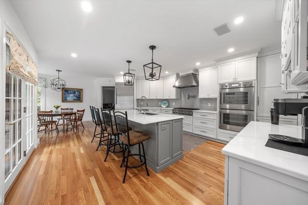Chandelier, Dining room, Interior, Kitchen, Pendant Lights, Recessed Lighting, Stainless Steel Appliances, Wood Texture Flooring