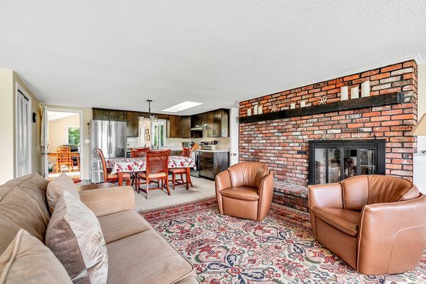 Dining room, Fireplace, Interior, Kitchen, Living room, Pendant Lights, Stainless Steel Appliances, Stone Walls