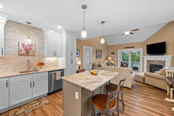 Fireplace, Interior, Kitchen, Living room, Pendant Lights, Recessed Lighting, Stainless Steel Appliances, Stone Walls, Wood Texture Flooring