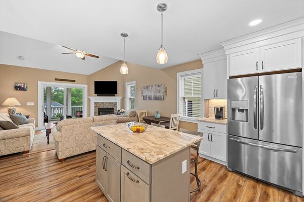 Dining room, Fireplace, Interior, Kitchen, Living room, Pendant Lights, Recessed Lighting, Stainless Steel Appliances, Wood Texture Flooring