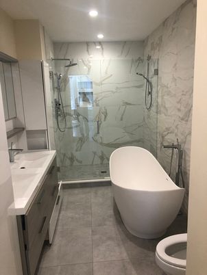 Bathroom, Dual Sink Vanities, Free Standing Baths, Glass Shower, Interior, Marble Walls, Recessed Lighting