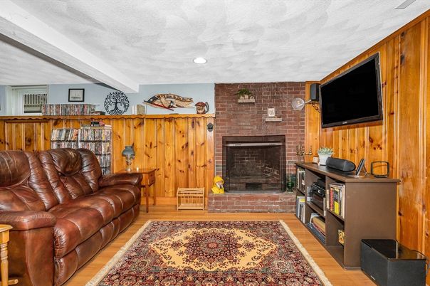 Fireplace, Interior, Living room, Recessed Lighting, Stone Walls, Wood Texture Flooring, Wooden Walls