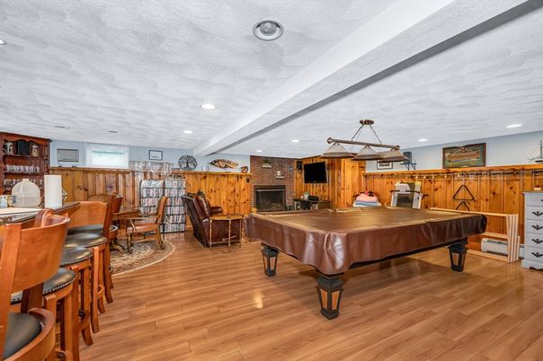 Billiard Table, Fireplace, Game Room, Interior, Pendant Lights, Recessed Lighting, Stone Walls, Wood Texture Flooring, Wooden Walls
