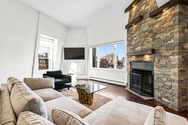Fireplace, Interior, Living room, Recessed Lighting, Stone Walls, Wood Texture Flooring
