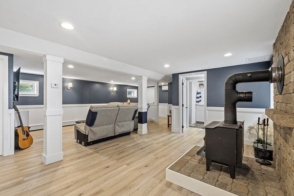 Fireplace, Interior, Living room, Recessed Lighting, Stone Walls, Wood Texture Flooring