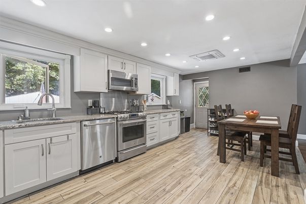 Dining room, Interior, Kitchen, Recessed Lighting, Stainless Steel Appliances, Wood Texture Flooring