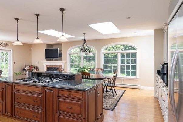 Dining room, Fireplace, Interior, Kitchen, Pendant Lights, Recessed Lighting, Stainless Steel Appliances, Wood Texture Flooring