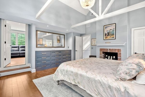 Bedroom, Chandelier, Fireplace, Interior, Recessed Lighting, Wood Texture Flooring