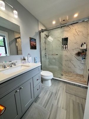 Bathroom, Glass Shower, Interior, Marble Walls, Recessed Lighting, Wood Texture Flooring
