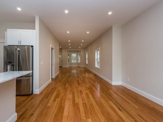 Empty room, Interior, Kitchen, Recessed Lighting, Stainless Steel Appliances, Wood Texture Flooring