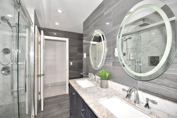 Bathroom, Dual Sink Vanities, Glass Shower, Interior, Marble Walls, Recessed Lighting, Wood Texture Flooring