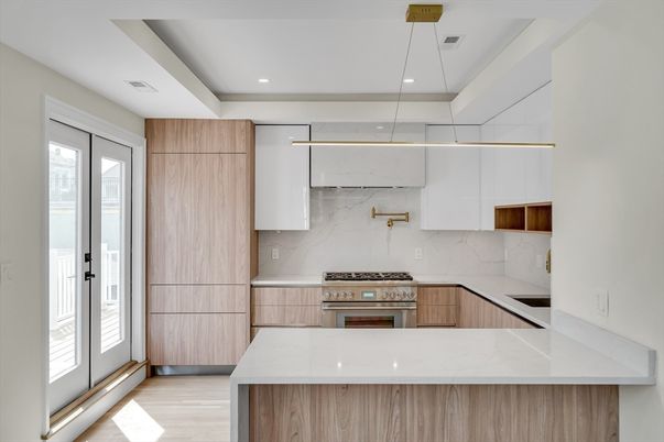 Interior, Kitchen, Marble Walls, Pendant Lights, Recessed Lighting, Stainless Steel Appliances, Wood Texture Flooring