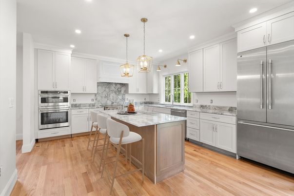 Interior, Kitchen, Marble Walls, Pendant Lights, Recessed Lighting, Stainless Steel Appliances, Wood Texture Flooring