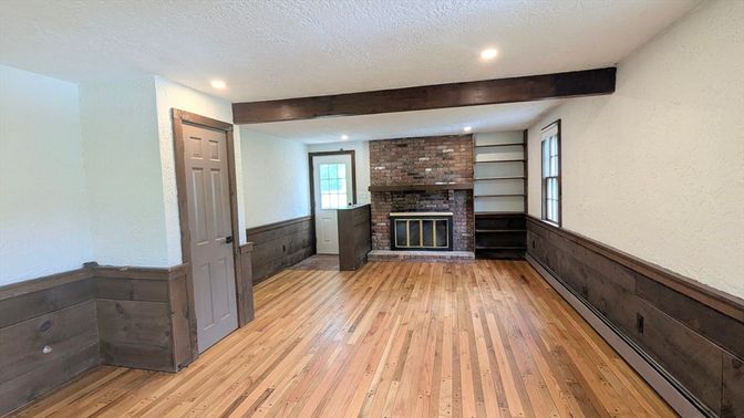 Empty room, Fireplace, Interior, Recessed Lighting, Stone Walls, Wood Texture Flooring