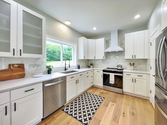 Interior, Kitchen, Marble Walls, Recessed Lighting, Stainless Steel Appliances, Wood Texture Flooring