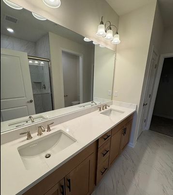 Bathroom, Dual Sink Vanities, Interior, Marble, Marble Walls, Recessed Lighting