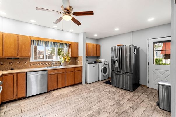 Interior, Kitchen, Recessed Lighting, Washer, Wood Texture Flooring