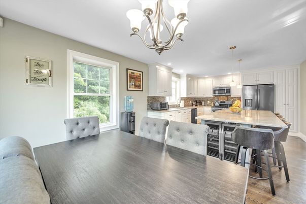 Chandelier, Dining room, Interior, Kitchen, Pendant Lights, Recessed Lighting, Stainless Steel Appliances, Wood Texture Flooring