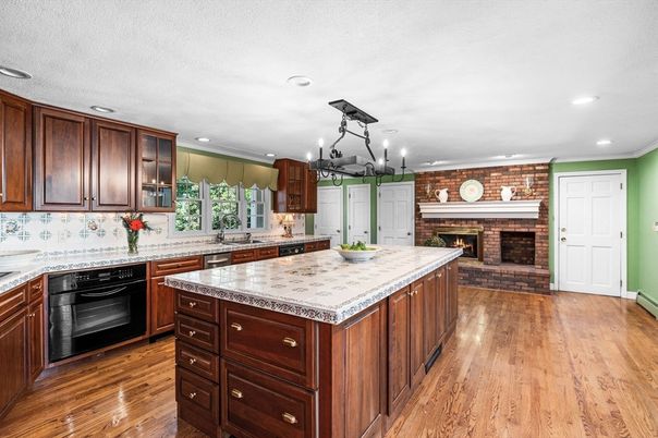 Chandelier, Fireplace, Interior, Kitchen, Pendant Lights, Recessed Lighting, Stone Walls, Wood Texture Flooring