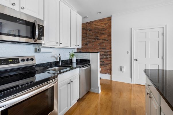 Interior, Kitchen, Recessed Lighting, Stainless Steel Appliances, Stone Walls, Wood Texture Flooring
