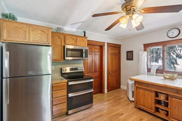 Interior, Kitchen, Stainless Steel Appliances, Tile Countertops, Wood Texture Flooring