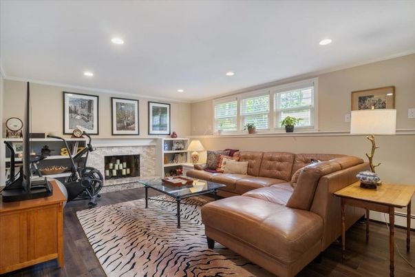 Fireplace, Fitness Equipment, Interior, Living room, Recessed Lighting, Wood Texture Flooring