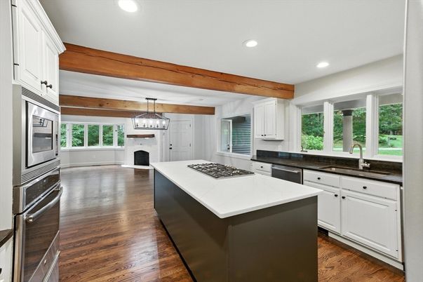 Fireplace, Interior, Kitchen, Pendant Lights, Recessed Lighting, Stainless Steel Appliances, Wooden Beams, Wood Texture Flooring