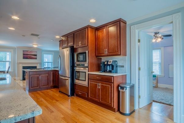 Fireplace, Interior, Kitchen, Recessed Lighting, Stainless Steel Appliances, Wood Texture Flooring