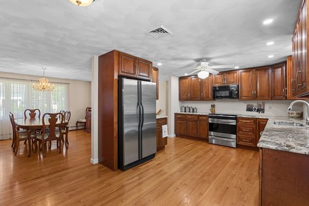 Chandelier, Dining room, Interior, Kitchen, Recessed Lighting, Stainless Steel Appliances, Wood Texture Flooring