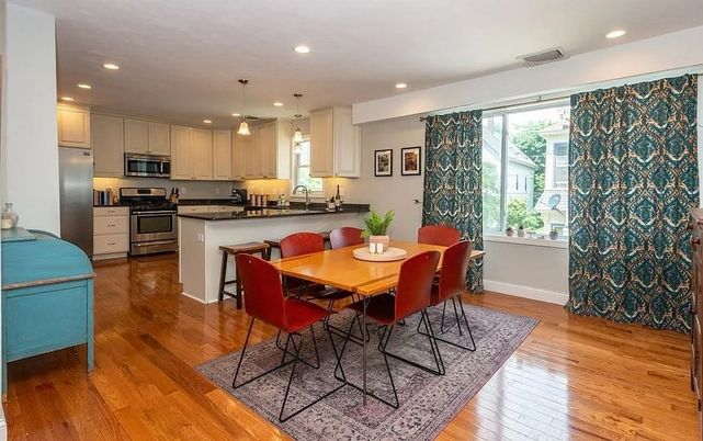 Dining room, Interior, Kitchen, Pendant Lights, Recessed Lighting, Stainless Steel Appliances, Wood Texture Flooring