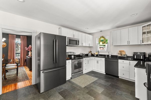 Dining room, Interior, Kitchen, Pendant Lights, Recessed Lighting, Stainless Steel Appliances, Wood Texture Flooring