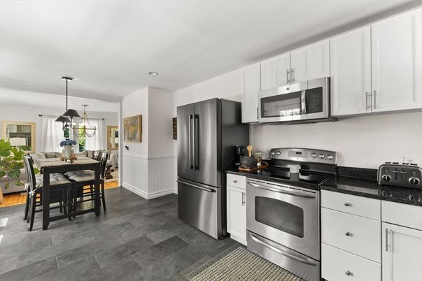 Dining room, Interior, Kitchen, Pendant Lights, Recessed Lighting, Stainless Steel Appliances, Wood Texture Flooring