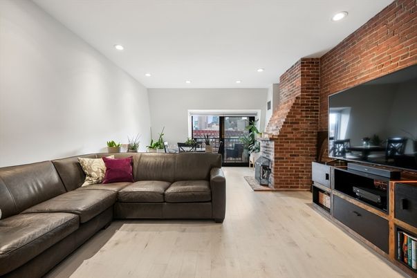 Fireplace, Interior, Living room, Recessed Lighting, Stone Walls, Wood Texture Flooring
