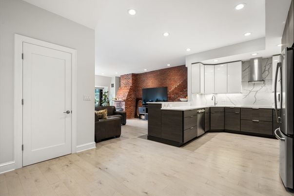 Interior, Kitchen, Living room, Marble Walls, Recessed Lighting, Stainless Steel Appliances, Stone Walls, Wood Texture Flooring