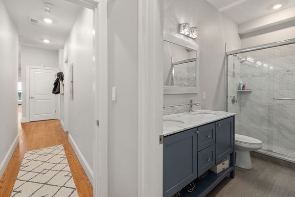 Bathroom, Glass Shower, Interior, Marble Walls, Recessed Lighting, Wood Texture Flooring