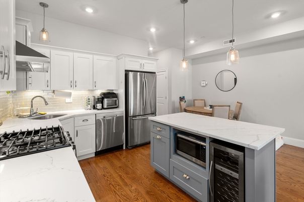 Dining room, Interior, Kitchen, Pendant Lights, Recessed Lighting, Stainless Steel Appliances, Wood Texture Flooring