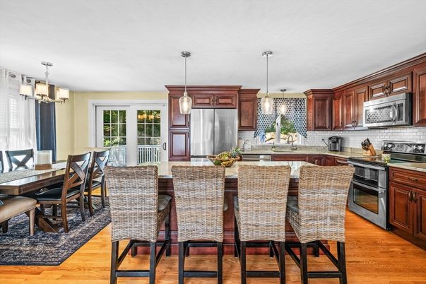 Chandelier, Dining room, Interior, Kitchen, Pendant Lights, Stainless Steel Appliances, Wood Texture Flooring