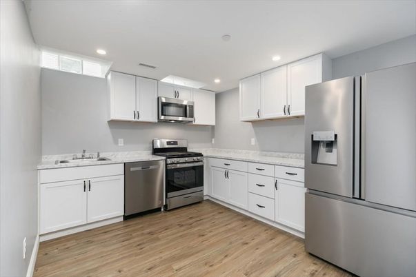 Interior, Kitchen, Recessed Lighting, Stainless Steel Appliances, Wood Texture Flooring
