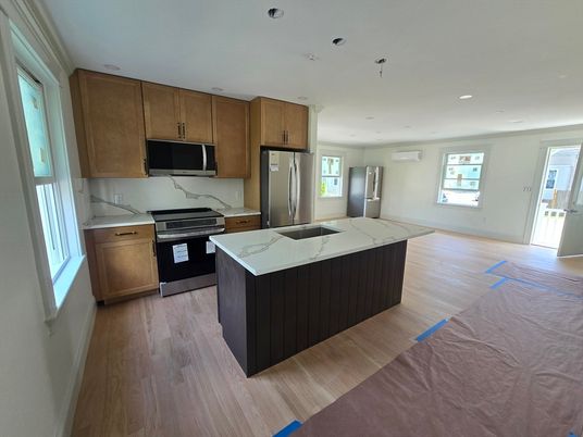 Interior, Kitchen, Marble Walls, Recessed Lighting, Stainless Steel Appliances, Wood Texture Flooring